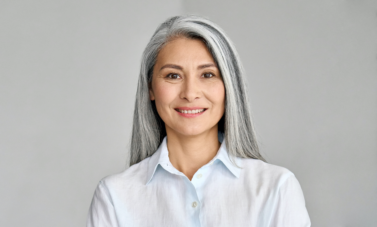 Smiling Woman with long white hair